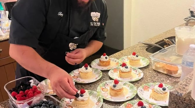 Private chef plating desserts in a vacation rental kitchen